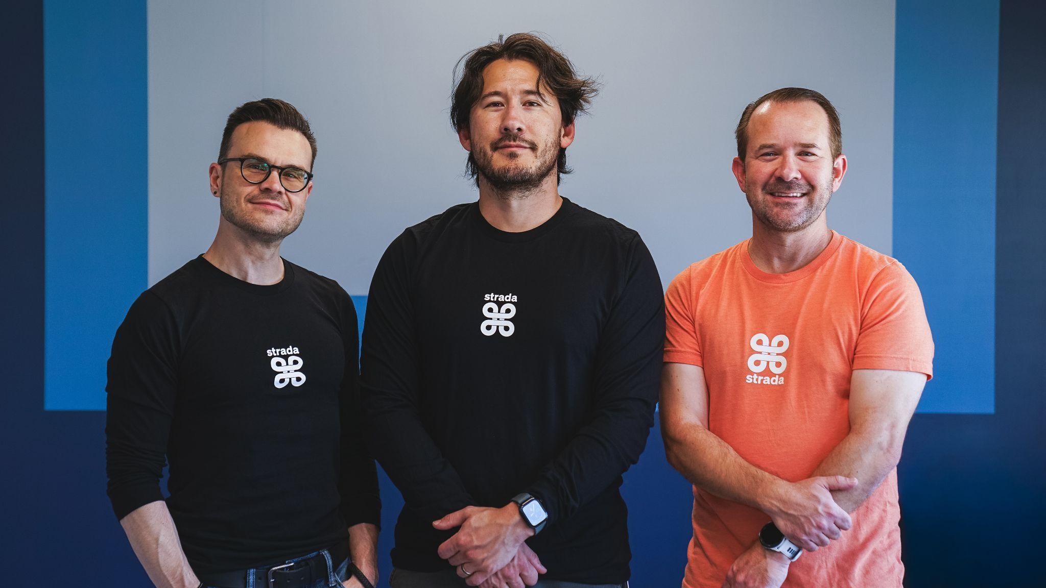 Mark Fischbach, known as Markiplier, center, with members of the Strada team.